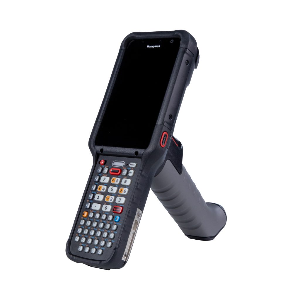 A construction worker pointing a barcode scanner in a warehouse aisle.